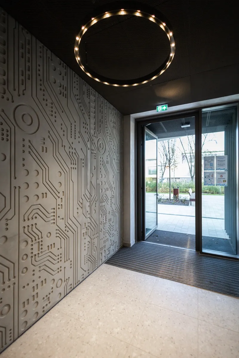 Entrance zone with a “printed circuit” relief — project by BBGK Architekci